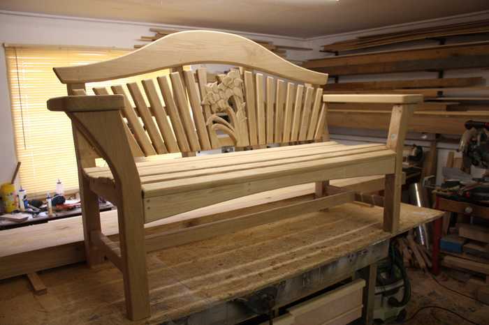 Bespoke carved bench in workshop