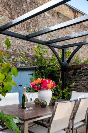 Bespoke Pergola in a garden with seating