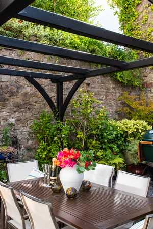 Bespoke Pergola in a garden with dining area