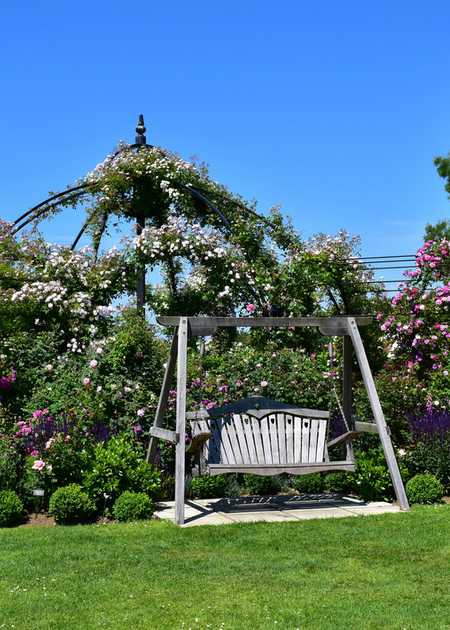 Swing Seat situated in a large garden area