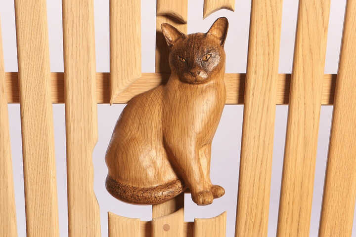Cat engraving on a bench