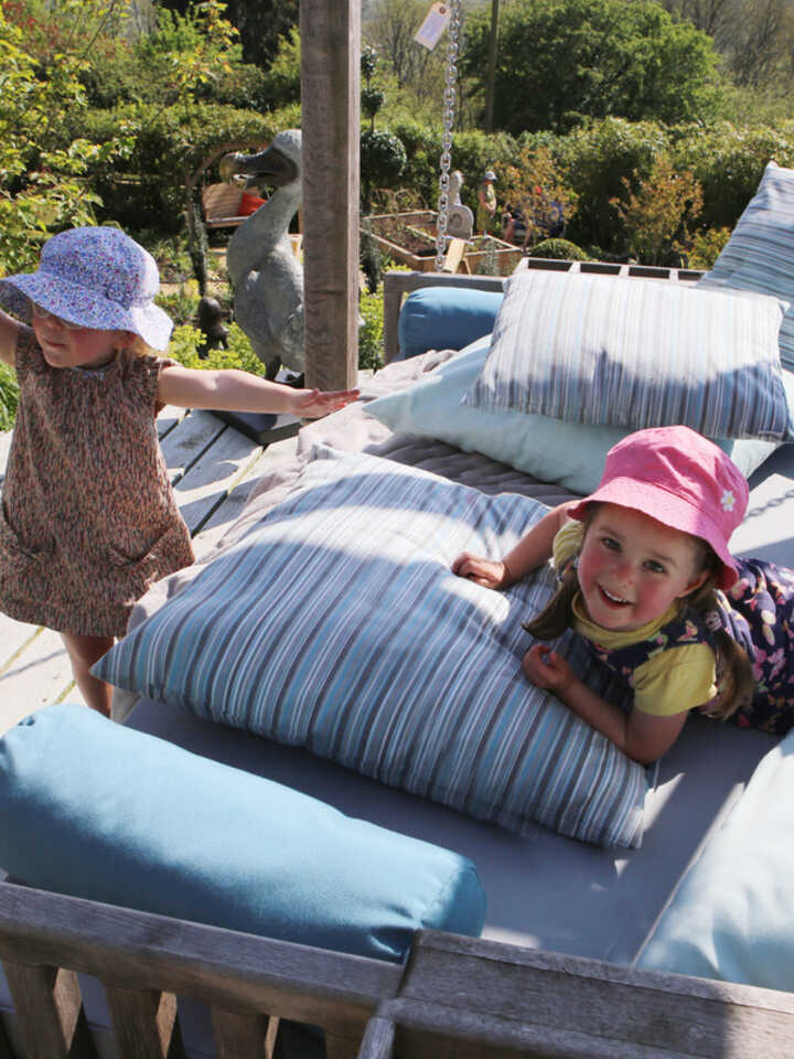 children-playing-on-swinging-day-bed.jpg