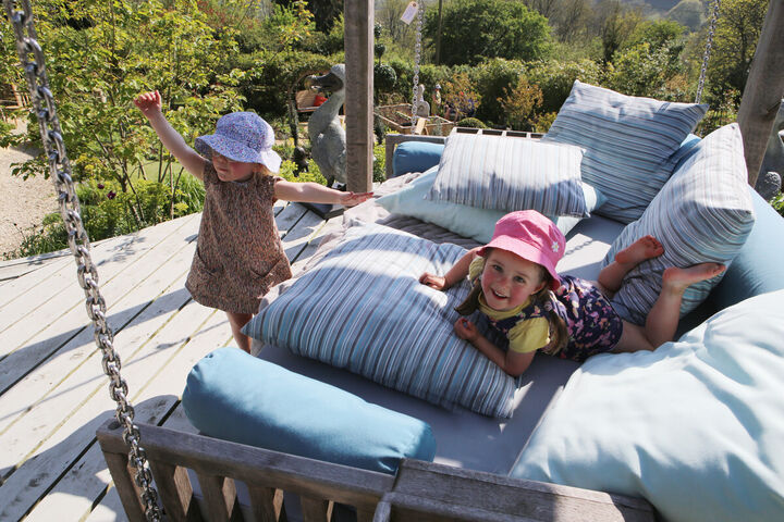 children-playing-on-swinging-day-bed.jpg