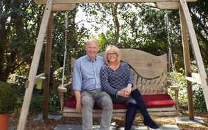 Couple enjoying relaxing on a swing seat at the Dower House Hotel