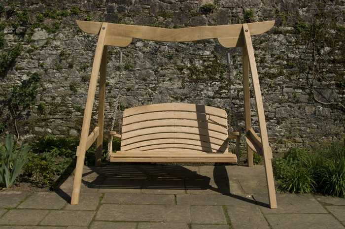 Curved oak beam swing seat on patio