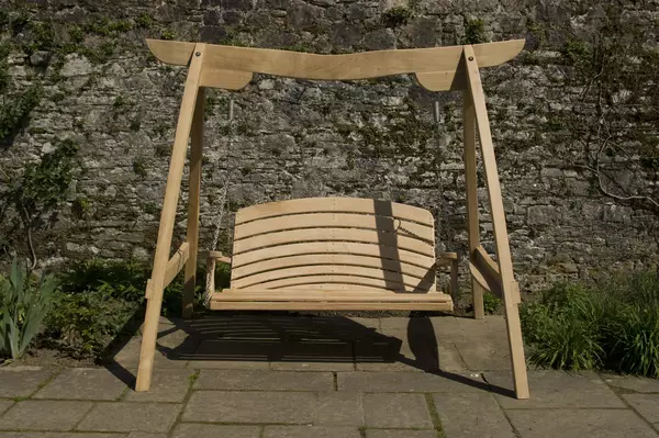 Garden Swing Seat The Kyokusen in Curved Oak Sitting Spiritually