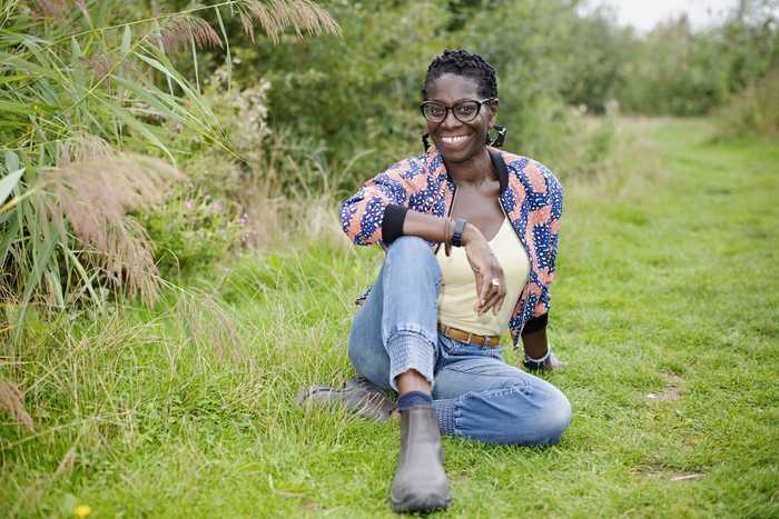 Flo Headlam sitting on the grass