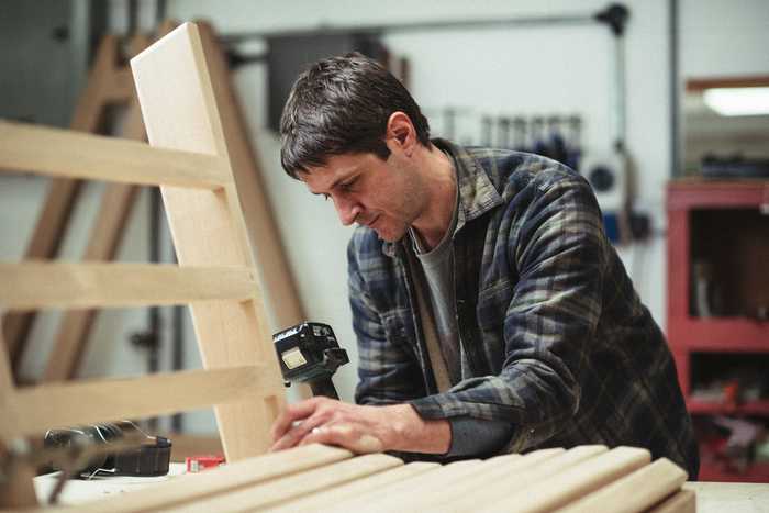 Craftsmen Building a Swing Seat