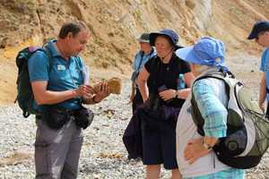 Jurassic Coast Ambassador John Scott leads a walk to Worbarrow Bay. Photo by Bella Ormerod.