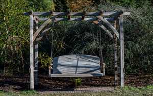 Two Seater Curve Back Swing Seat at RHS Rosemoor Gardens