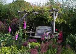 Creating a relaxing outdoor retreat with a pergola swing seat