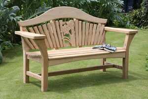 The RHS Centenary bench set on a well kept lawn