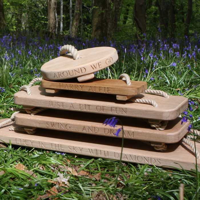 Stack of Sitting Spiritually Rope Swing Seats on a forest floor