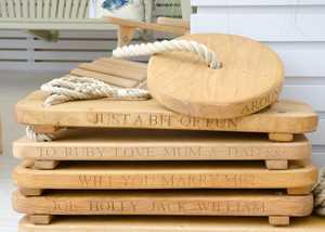 Stack of handcrafted rope swings with inscriptions