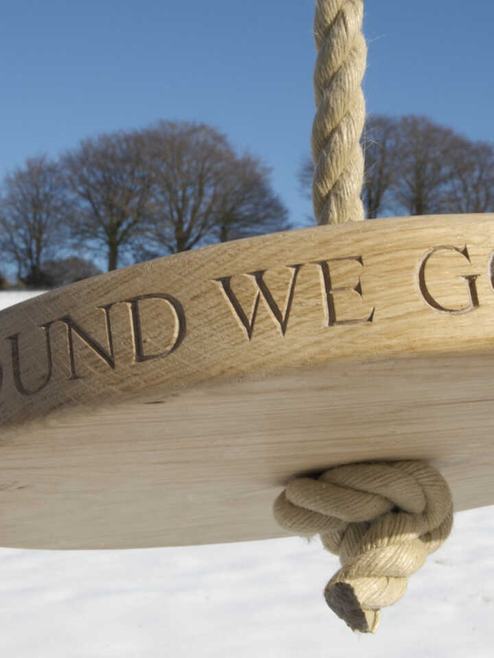 Sitting Spiritually Carved round oak swing