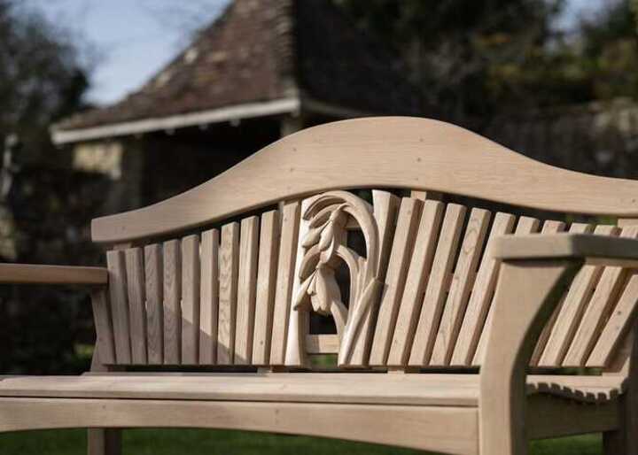 Garden bench close up with intricate inscription
