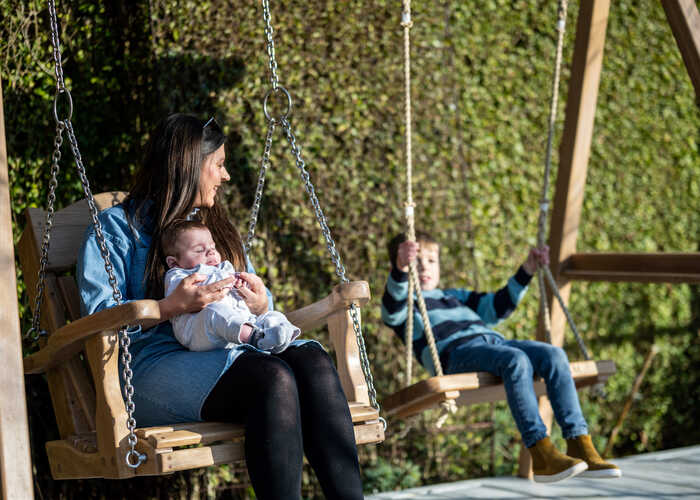 Mother and child swinging on the RHS Trilogy Swing