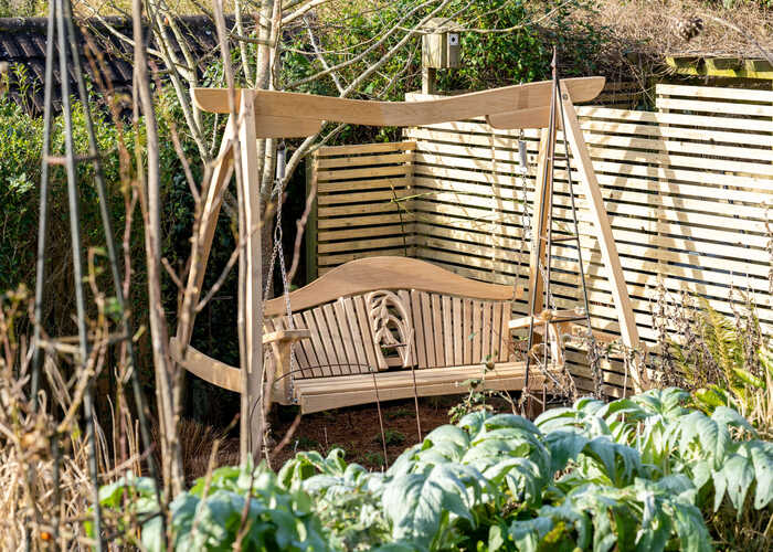 RHS Four Seasons Swing Seat in Garden