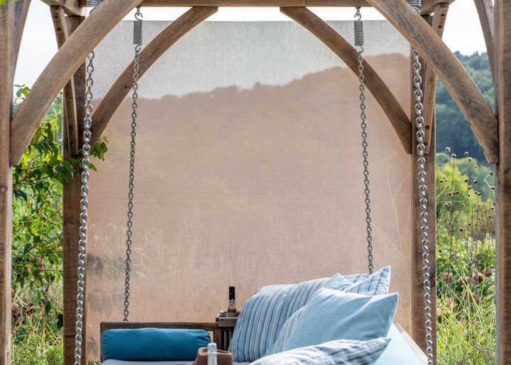 swing-seat-set-with-blue-pillows.webp