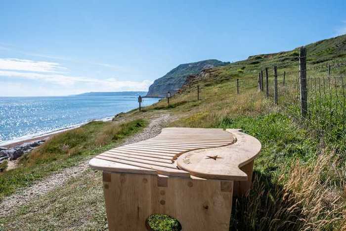 Garden bench overlooking the coast in Dorset