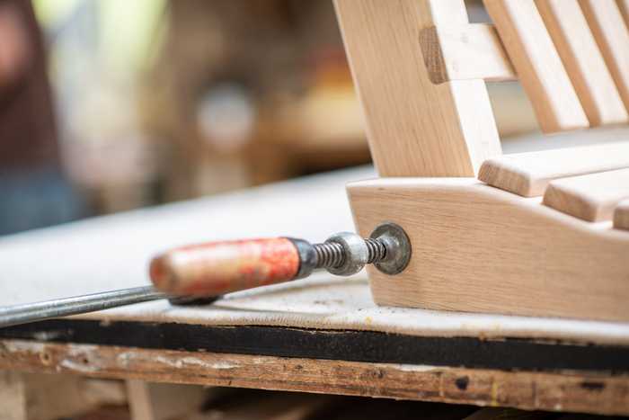 Garden swing seat being handcrafted in a workshop