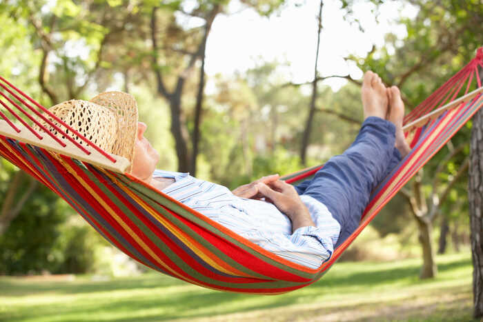 person asleep in a hammock