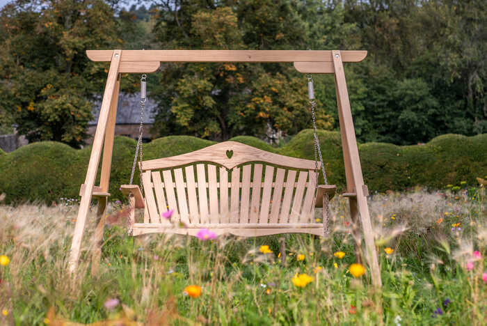 Garden swing seat with heart back design