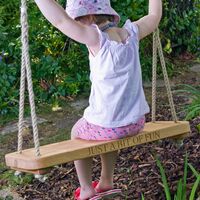 Sitting Spiritually Carved Rope Swing.jpg