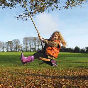 child on rope swing