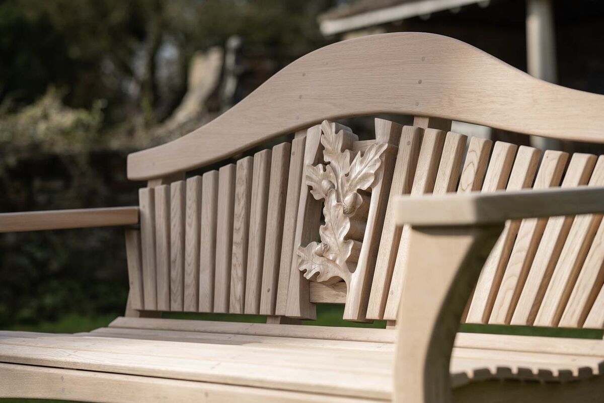 Sitting Spiritually RHS Four Seasons Bench Autumn carving close up.jpg