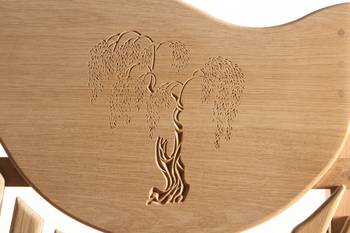 Willow tree carving on a bench